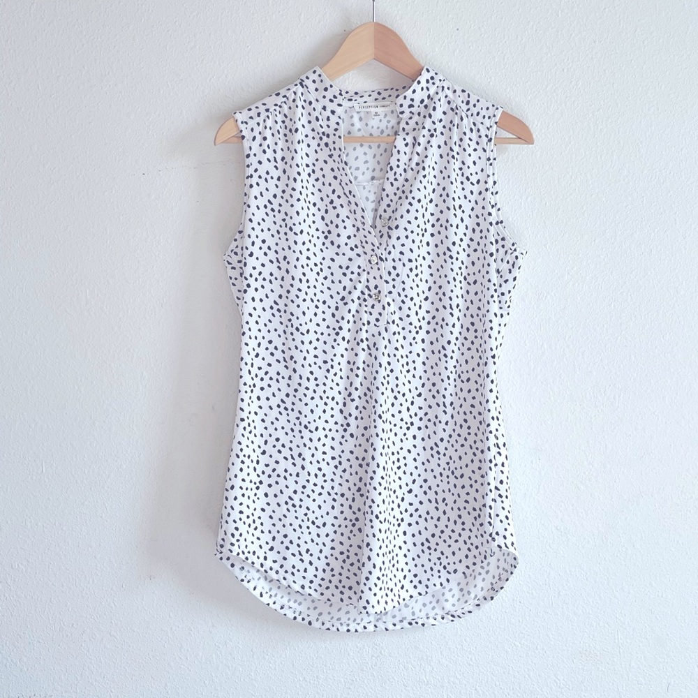 Spotted blouse black and white.